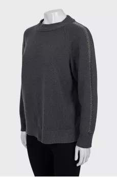 Sweater with sleeve decoration