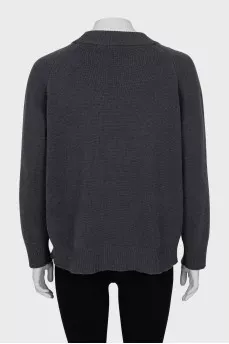 Sweater with sleeve decoration