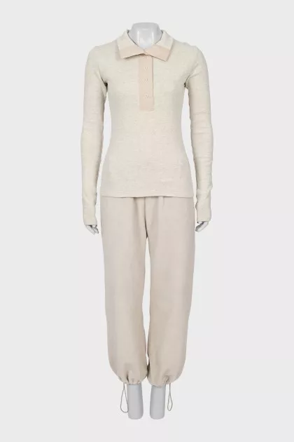 Suit of top and trousers with ties