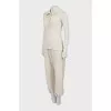 Suit of top and trousers with ties