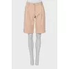 Beige shorts with tag
