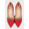 Red patent leather pumps