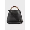 Leather bag with accent handle