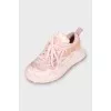 Pink sneakers with a massive sole