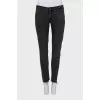 Black jeans with raw edges