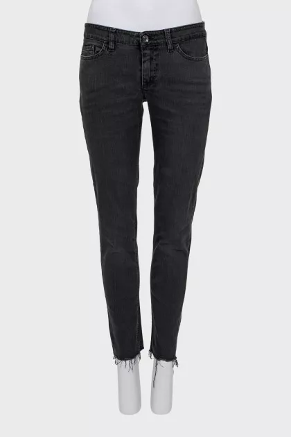 Black jeans with raw edges