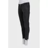 Black jeans with raw edges
