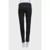 Black jeans with raw edges