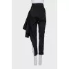 Asymmetrical cut trousers with stripes