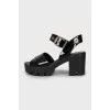 Black leather sandals with heels