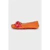 Suede moccasins decorated with bows