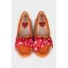 Suede moccasins decorated with bows