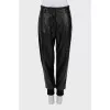 Leather trousers with textile inserts