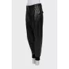 Leather trousers with textile inserts