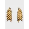 Gold earrings in the shape of a spike