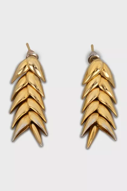 Gold earrings in the shape of a spike