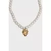 Pearl necklace with a bull pendant