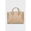 Leather bag with branded logo on the clasp