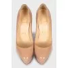 Beige high heel shoes