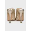 Gold colored leather shoes