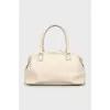 Leather bag with woven pocket