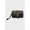 Leather clutch with metal decor