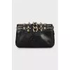 Leather clutch with metal decor