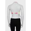 Swimsuit with a bright print and tag