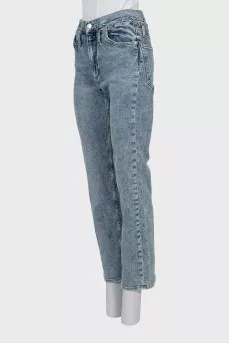 Jeans decorated with lacing