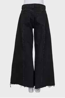 Flared jeans with raw seams