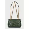 Green leather bag with brand logo