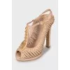 Pink sandals with gold decor