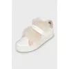 Leather sneakers decorated with fur