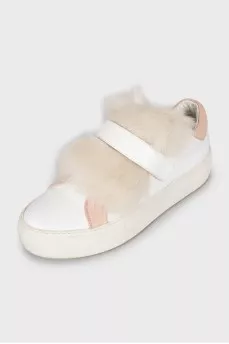 Leather sneakers decorated with fur