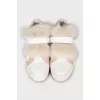 Leather sneakers decorated with fur
