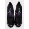 Black leather shoes with a figured heel