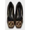 Shoes decorated with the company logo
