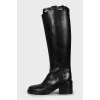 Leather boots decorated with straps
