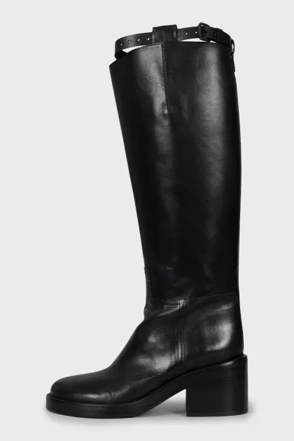 Leather boots decorated with straps