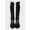 Leather boots decorated with straps