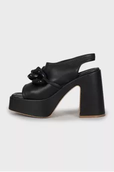 Leather sandals with massive decor