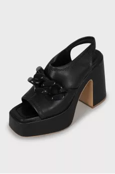 Leather sandals with massive decor
