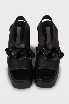 Leather sandals with massive decor