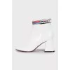 White ankle boots with trapezoid heels