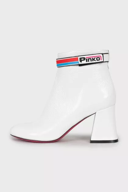 White ankle boots with trapezoid heels