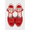 Red sandals decorated with bows