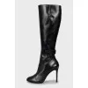 Leather boots with straps and stiletto heels