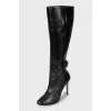 Leather boots with straps and stiletto heels