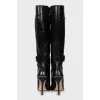 Leather boots with straps and stiletto heels