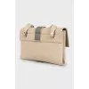 Leather bag decorated with fringe